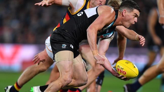 Tom Rockliff handballs during the Showdown 46 loss to the Crows. Picture: DAVID MARIUZ, AAP