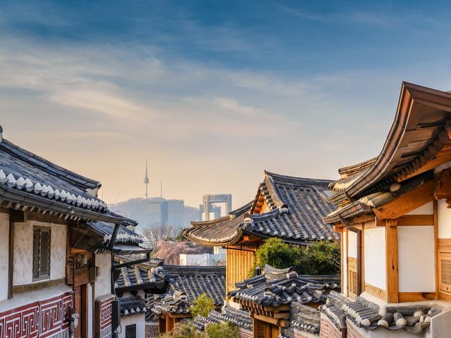 Bukchon Hanok Village and Seoul city skyline, Seoul, South Korea