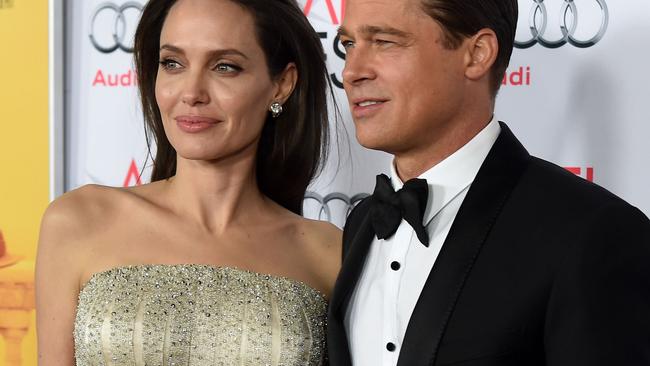 HOLLYWOOD, CA - NOVEMBER 05: Writer-director-producer-actress Angelina Jolie Pitt (L) and actor-producer Brad Pitt attend the opening night gala premiere of Universal Pictures' "By the Sea" during AFI FEST 2015 presented by Audi at TCL Chinese 6 Theatres on November 5, 2015 in Hollywood, California. Kevin Winter/Getty Images/AFP == FOR NEWSPAPERS, INTERNET, TELCOS & TELEVISION USE ONLY ==