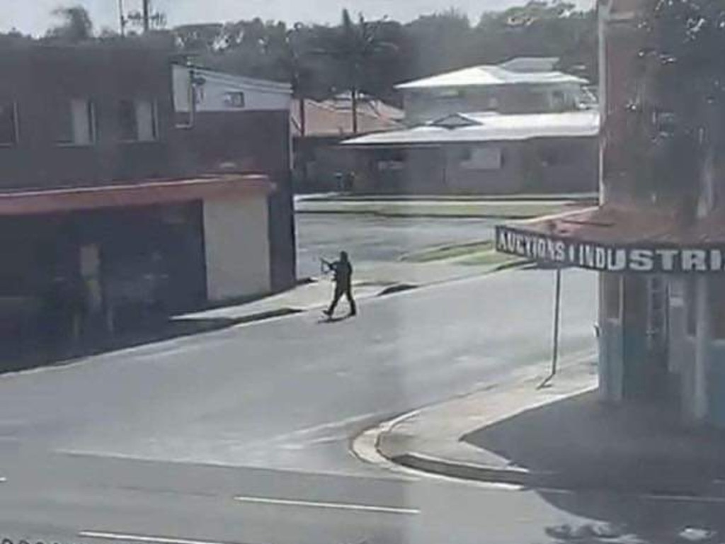 Screen grabs of footage on social media of the arrest of the alleged gunman who allegedly fired shots on a busy street in Windang, near Wollongong.