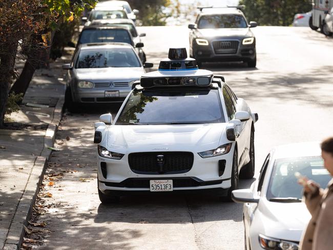 (FILES) A Waymo autonomous vehicle on Steiner Street in San Francisco, on November 17, 2023. The National Highway Traffic Safety Administration (NHTSA) on May 14, 2024, said it had opened an investigation into Google-owned Waymo after reports of 22 incidents with its self-driving technology. The preliminary probe into the robotaxi company will cover the firm's 444 vehicles, according to documents posted on the agency's website. (Photo by Jason Henry / AFP)