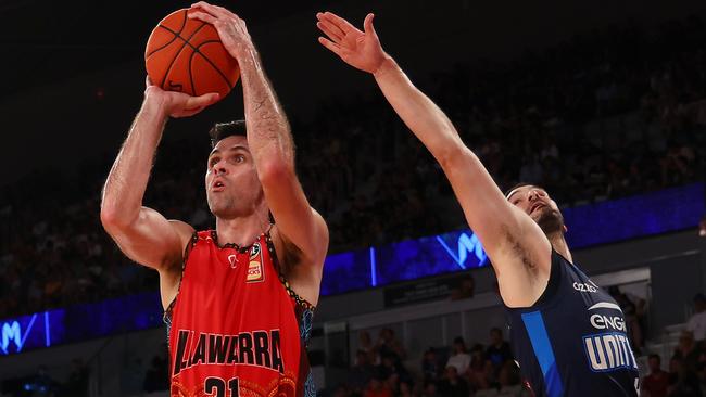 MELBOURNE, AUSTRALIA - FEBRUARY 18: Todd Blanchfield of the Hawks shoots under pressure from Chris Goulding of United during the round 20 NBL match between Melbourne United and Illawarra Hawks at John Cain Arena on February 18, 2024, in Melbourne, Australia. (Photo by Graham Denholm/Getty Images)