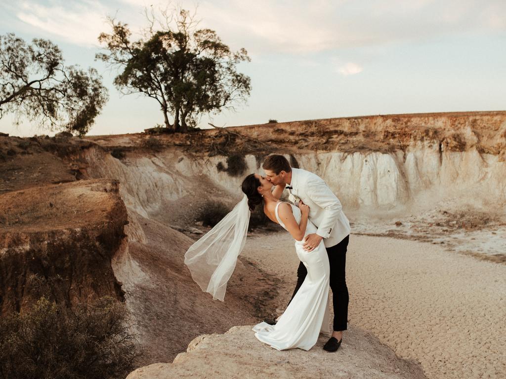 Emma Barratt and Adam Kupsch, married at Holy Trinity Catholic Church. The Crystal Brook couple planned to wed in front of 180 guests but progressively scaled back their plans to just five people for the ceremony.