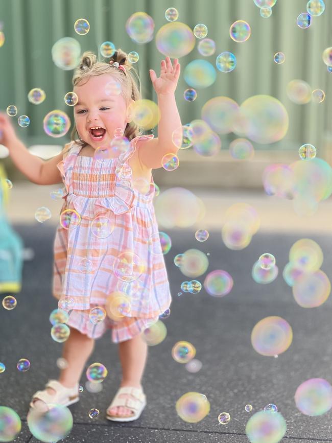 Laylah Dimsey, 18 months, in the backyard in Echuca just after Christmas with her bubble machine. She was so excited to chase the bubbles. Picture: Linda Dimsey, Echuca.