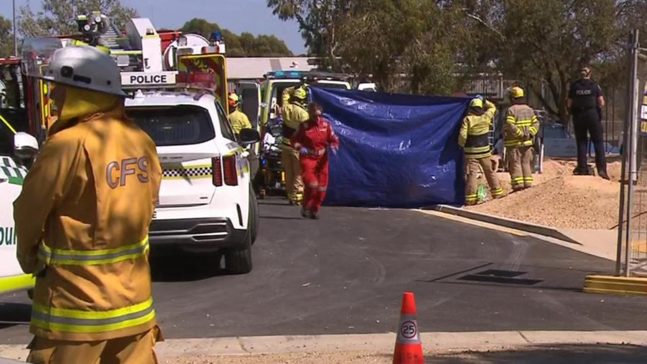 A worker has been rushed to hospital after becoming trapped under an excavator that rolled at a One Tree Hill construction site. Picture: 7NEWS