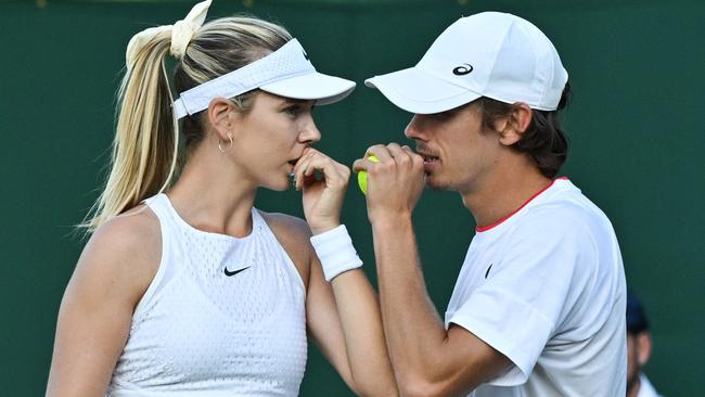 Katie Boulter and Alex De Minaur during their mixed doubles tennis match at Wimbledon. Photo by Glyn KIRK / AFP.