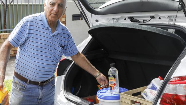 One of the residents handing over chemicals during February’s clean up. Picture: Jason Nichol/City of Canterbury Bankstown