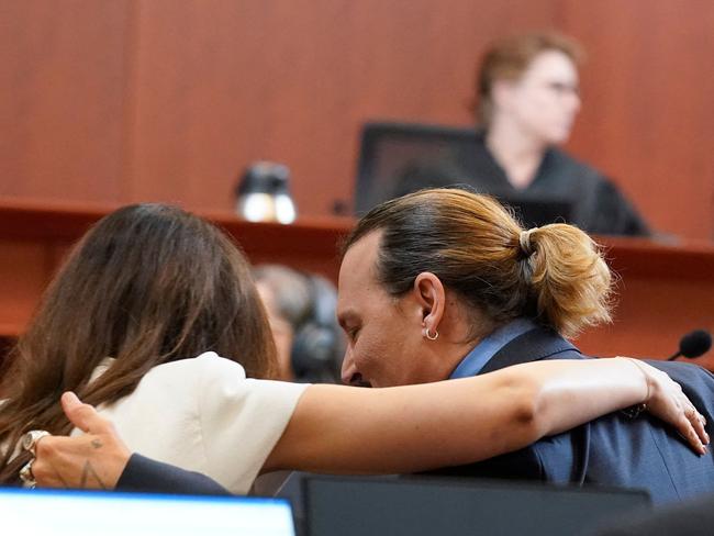 Johnny Depp talks with his attorney Camille Vasquez. Fans have speculated they are dating. Picture: AFP