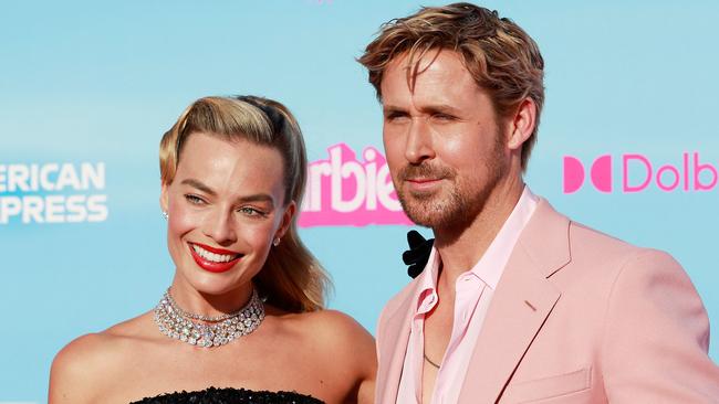 Australian actress Margot Robbie and Canadian-US actor Ryan Reynolds arrive for the world premiere of "Barbie" at the Shrine Auditorium in Los Angeles, on July 9, 2023. (Photo by Michael Tran / AFP)