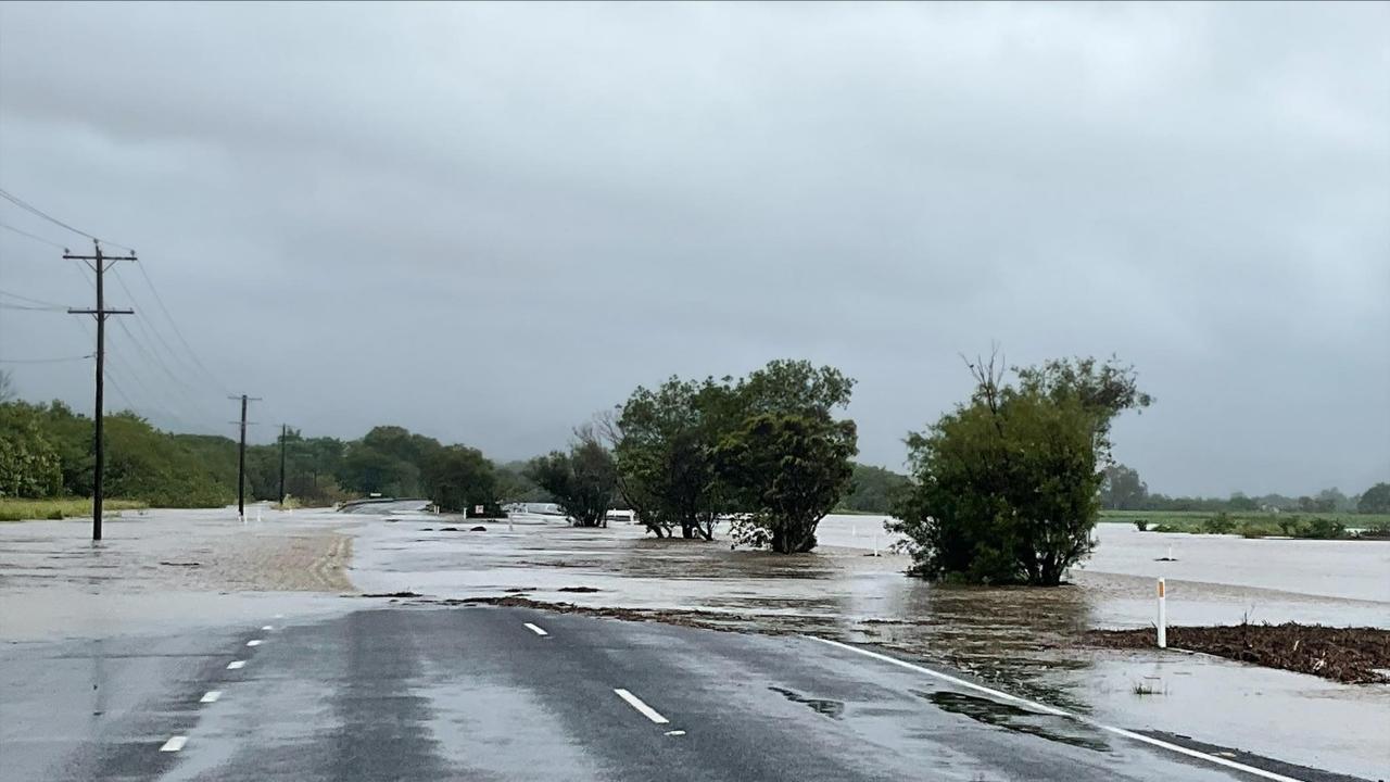 The banks at Thomatis Creek between Yorkeys Knob and Holloways Beach, has overflowed, cutting off motorists travelling along the Bruce Highway.