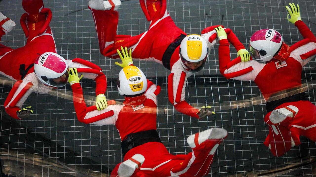 Members of the Indonesian team perform during the 4-way formation skydiving competition at the FAI World Cup of Indoor Skydiving in Macau. Picture: Eduardo Leal/AFP