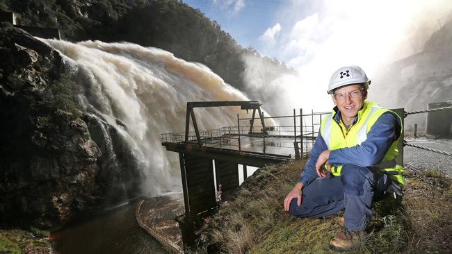 Hydro Tasmania Dam Safety Manager Chris Topham at the flowing spillway of the Cethana Dam.