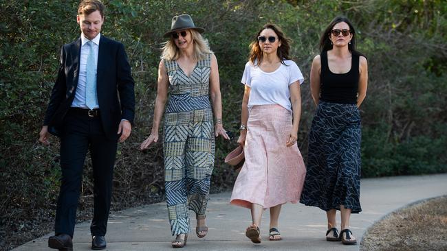 The family of Ngeygo Ragurrk's lawyer James Lowrey, left, with coroner Elisabeth Armitage, counsel assisting Peggy Dwyer and Maria Walz take part in a ceremony at Mindil Beach, where on December 23 2019 the 40-year-old woman was killed by her partner Garsek Nawirridj. Picture: Pema Tamang Pakhrin