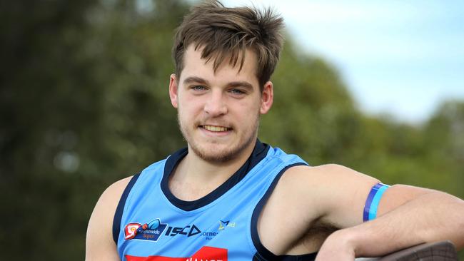 Sturt’s Casey Voss modelling the purple and blue armbands SANFL players will don this weekend in support of mental health. Picture: Dean Martin.