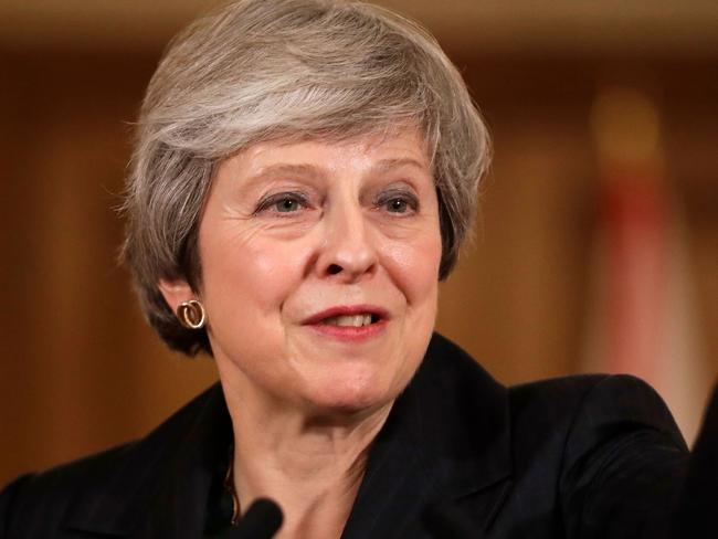 Britain's Prime Minister Theresa May gives a press conference inside 10 Downing Street in central London on November 15, 2018. - British Prime Minister Theresa May battled against a rebellion over her draft Brexit deal on Thursday, as ministers resigned and members of her own party plotted to oust her. (Photo by Matt Dunham / POOL / AFP)