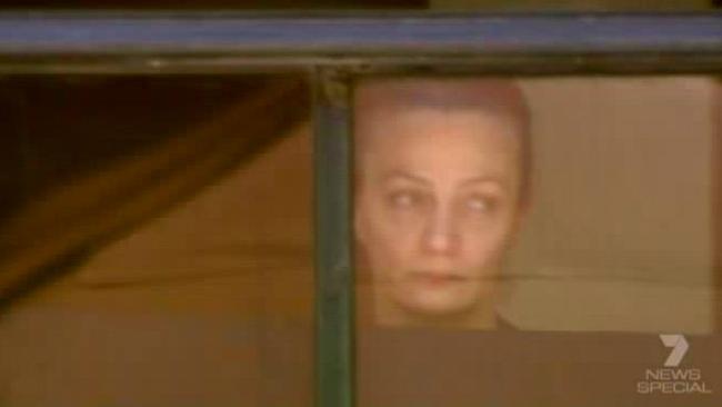 Marcia Mikhael at the window of the Lindt Cafe during the siege. Picture: Seven News