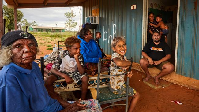 Matthew Mulladad, right, with some of his relatives who live at the bush camp at Arlparra, 350km northeast of Alice Springs. Picture: Liam Mendes