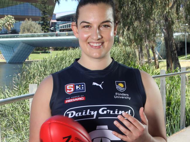 SANFLW players Brianna Cleggett, (South Adelaide), Madi Russell (West Adelaide) and Kate Harris (Sturt) in playing kits with a footy, celebrating the introduction of a salary cap and player payments in the women's league from 2025. 30 November 2023. Picture Dean Martin