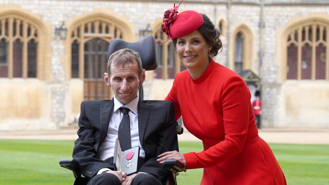 Leeds Rhinos player Rob Burrow with his wife Lindsey after he was made an MBE. Photo by Steve Parsons-WPA Pool/Getty Images.