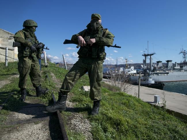Russian soldiers guard a pier in Sevastopol, on the Crimean Peninsula, in March 2014. Picture: AP