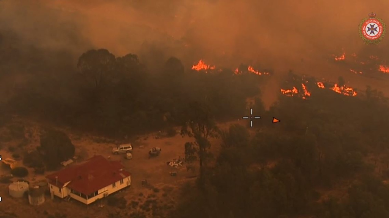 Fire threatens a home at Tara on Tuesday. Source: QFES