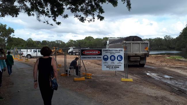 Trucks arrive at Black Swan Lake on the Gold Coast.