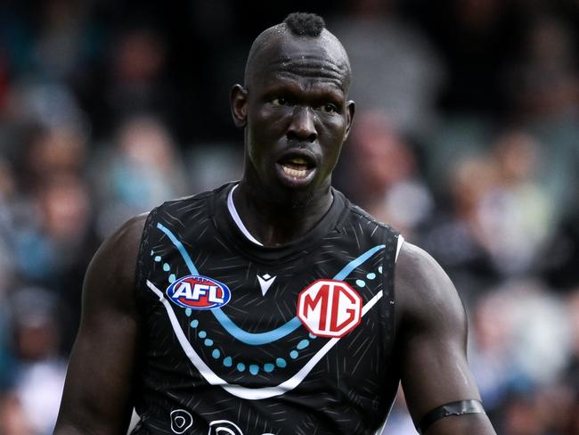 ADELAIDE, AUSTRALIA – MAY 19: Aliir Aliir of the Power kicks during the round 10 AFL match between Yartapuulti (the Port Adelaide Power) and Hawthorn Hawks at Adelaide Oval, on May 19, 2024, in Adelaide, Australia. (Photo by Mark Brake/Getty Images)