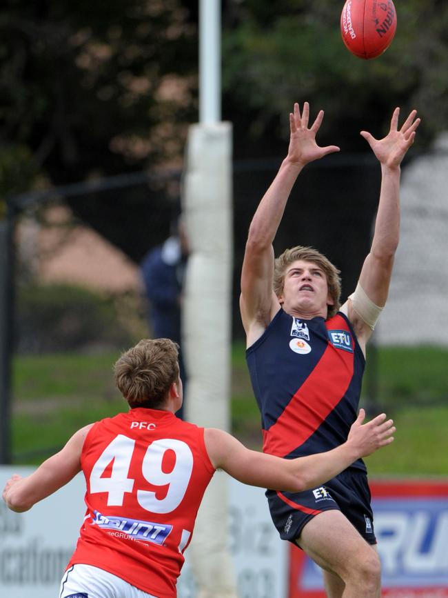 Nathan Blair flies for a mark during his VFL career with Coburg. 