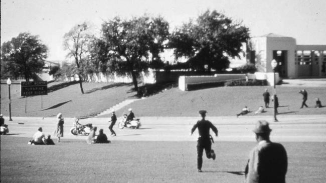 Moments after fatal shots were fired on President John F Kennedy at Dealey Plaza. Photographer: Wilma Bond