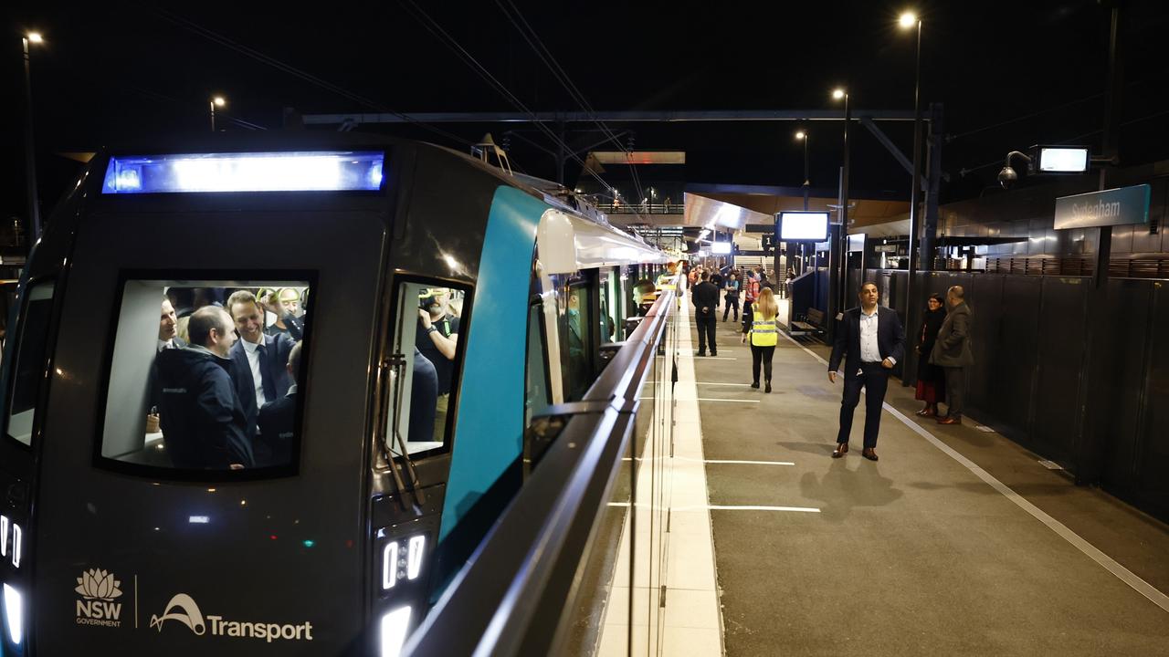 Pictured at Sydenham Station are the first passengers seen through the windows on the brand new Sydney Metro as it waits on the platform to begin its maiden run to Tallawong at 4.54am. Picture: Richard Dobson