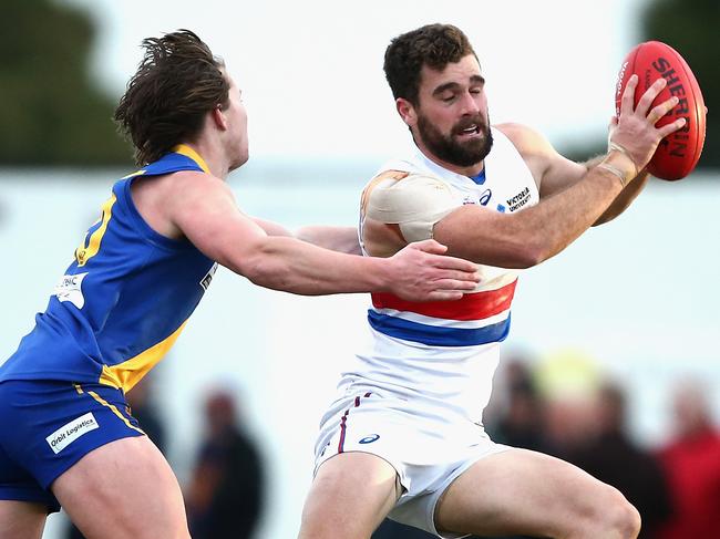 Kieran Collins dodges a tackle for Footscray against Williamstown.