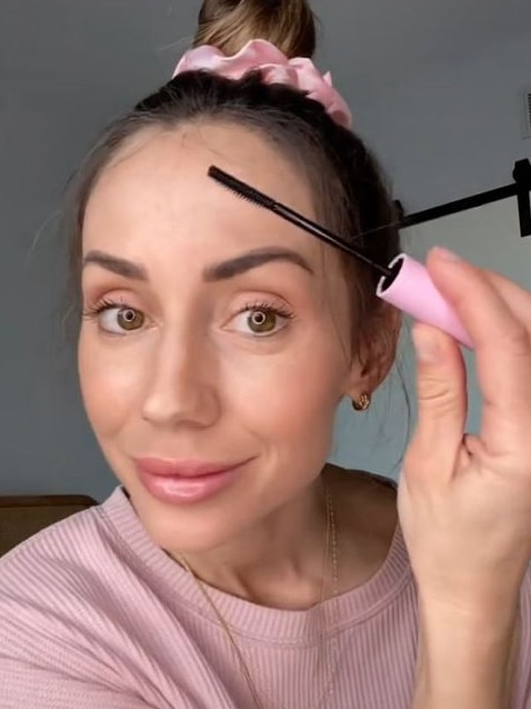 Videos of women using what looked like a mascara wand to effortless tame their flyaways went viral on TikTok. Picture: TikTok