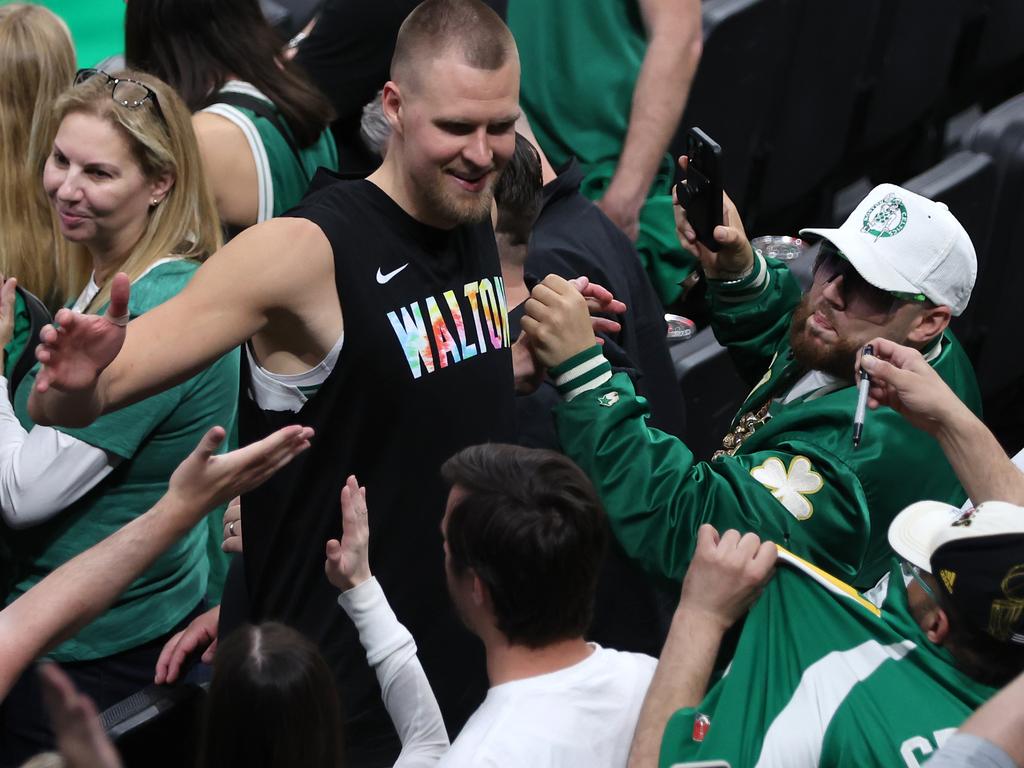 Porzingis all smiles amongst the Celtic fans post-game. Picture: Adam Glanzman/Getty Images