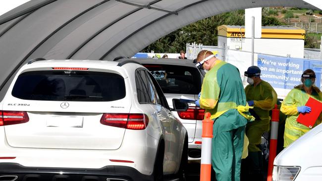 Medics perform COVID-19 tests at a drive-through COVID-19 testing centre. Picture: AFP