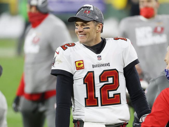 GREEN BAY, WISCONSIN - JANUARY 24: Tom Brady #12 of the Tampa Bay Buccaneers celebrates their 31 to 26 win over the Green Bay Packers during the NFC Championship game at Lambeau Field on January 24, 2021 in Green Bay, Wisconsin. (Photo by Dylan Buell/Getty Images)