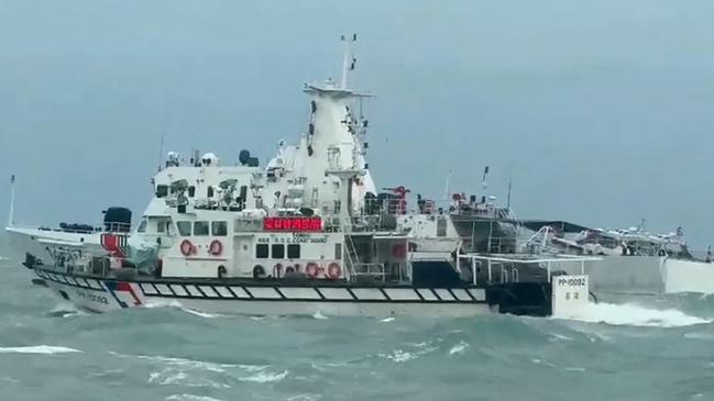 A Taiwan Coast Guard ship (front) and a Chinese Coast Guard ship (back) off the Matsu Islands in Taiwan as Beijing held military drills. Picture: AFP.