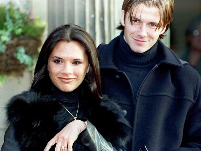 Victoria Beckham, then Victoria ‘Posh Spice’ Adams, shows off her engagement ring in 1998.