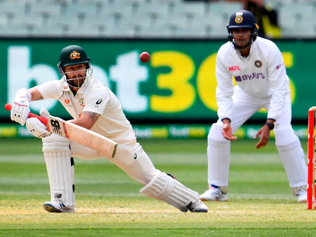 Matthew Wade (L) dug in at the top of the order in his makeshift role. Picture: AFP