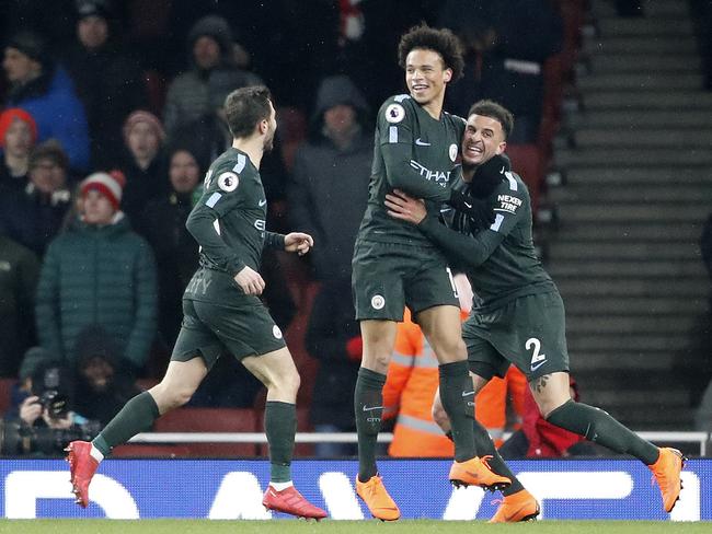 Manchester City's Leroy Sane celebrates after scoring his side's third goal