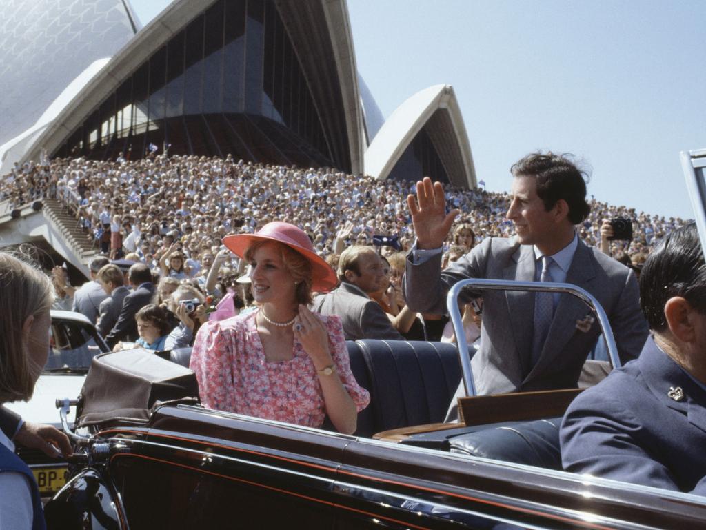 Charles and Diana acknowledge wellwishers from an open top car. Picture: Getty