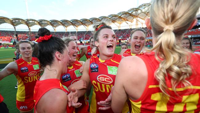 Suns celebrate winning the round 2 AFLW match between the Gold Coast Suns and the Richmond Tigers at Metricon Stadium on February 15, 2020 in Gold Coast, Australia. (Photo by Chris Hyde/AFL Photos/Getty Images)