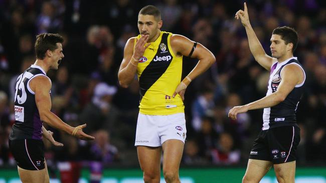 Jack Sinclair and Leigh Montagna celebrate a goal as Shaun Grigg watches on.