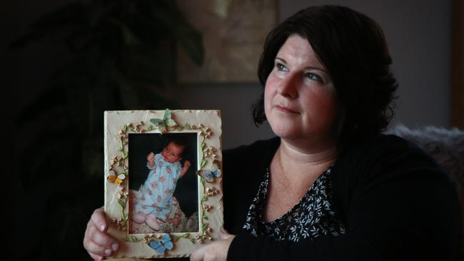 Sharyn Pitman with her baby Amie, who died of whooping cough 19 years ago. She wants to remind people of the importance of immunising children. Picture: Robert Pozo/AAP