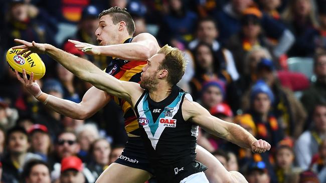 Josh Jenkins takes a strong grab behind Port’s Jack Hombsch. Picture: Mark Brake/Getty Images