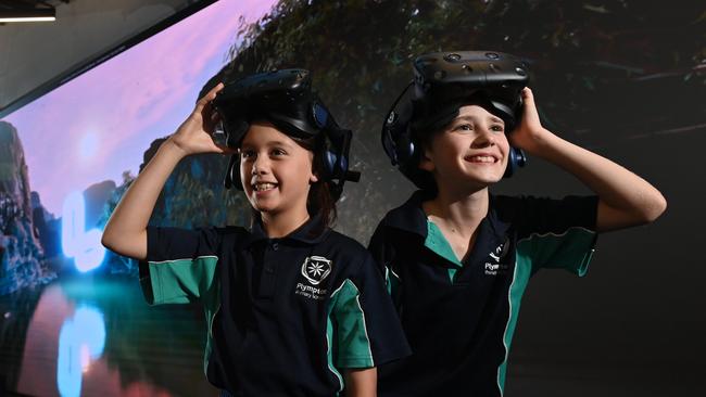 26/5/22. Eliza Teoh - 9yrs and Kazys Stephens - 9yrs with VR Headsets enjoying  immersive technology at the Lumination Learning Lab, Thebarton.  Picture: Keryn Stevens