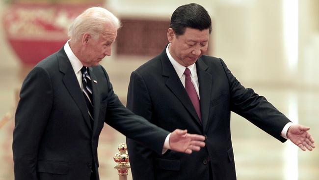 Chinese President Xi Jinping, right, invites then US vice-president Joe Biden to view an honour guard at the Great Hall of the People in Beijing in 2011.