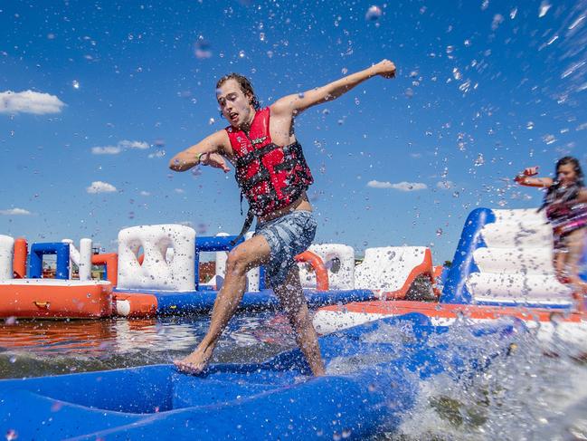 Seymour butte , 23, Lane Cole-Delu, 26 and Charlie Moir, 26. Melbourne Cable Park water playground and obstacle course. Picture: Jason Edwards