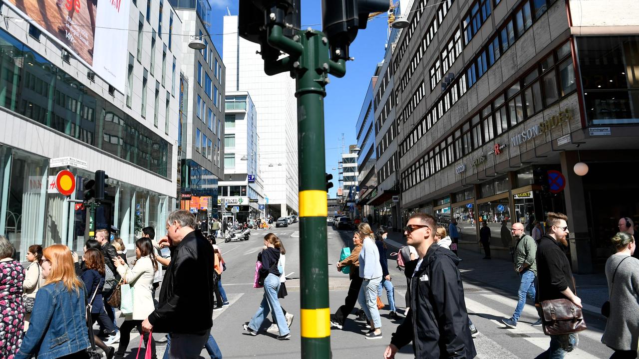 Shoppers still out on Drottninggatan, the Bourke St of central Stockholm. Picture: Henrik MONTGOMERY / TT News Agency / AFP.