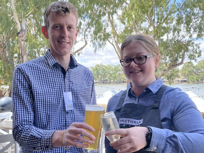 Pretoria Hotel venue manager Brad Harper and staff member Chloe Underwood celebrate the reopening of the popular Mannum hotel. Picture: Dylan Hogarth