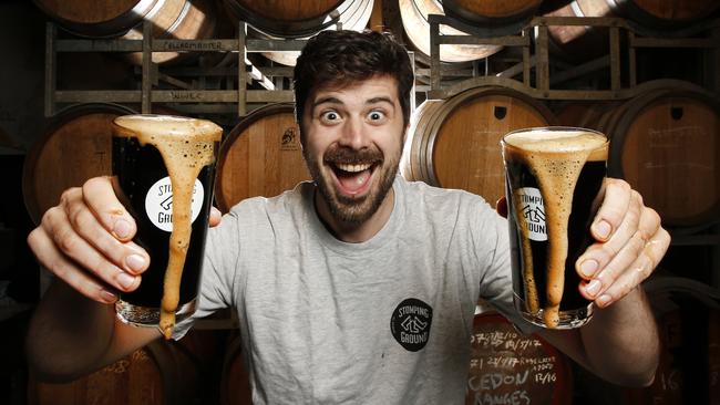 Beer lover Nick Malin knocks back a Stave Breaker Russian Imperial Stout at Stomping Ground Brewery in Collingwood. Picture: David Caird